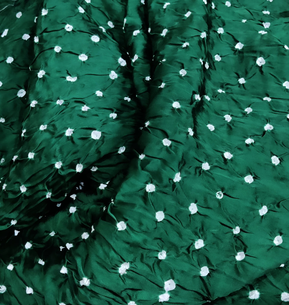 Green fabric with white floral patterns