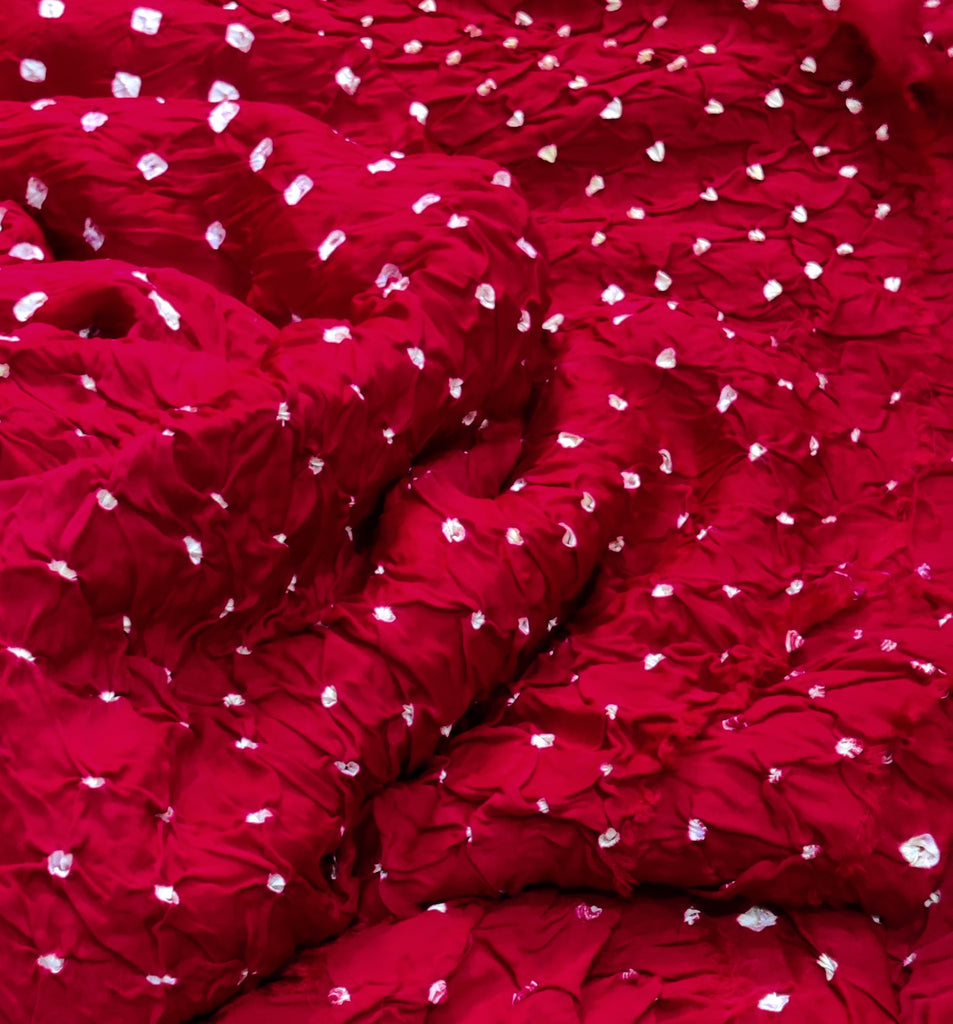 Red fabric with white floral patterns