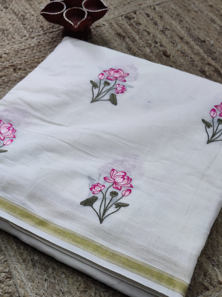 White fabric with floral embroidery on a textured surface