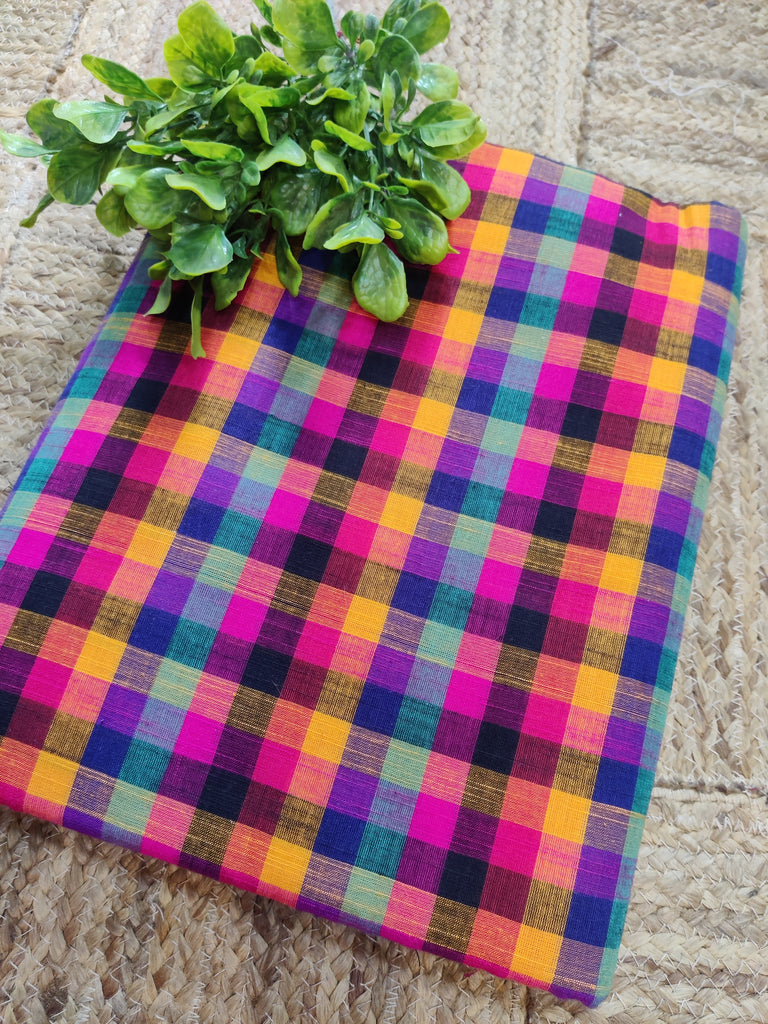 Colorful checkered fabric on a textured surface