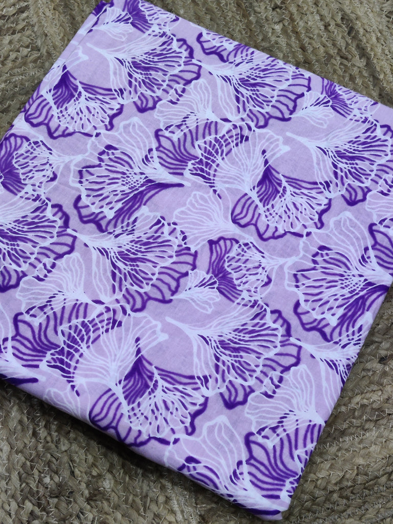 Purple floral patterned fabric on a textured surface