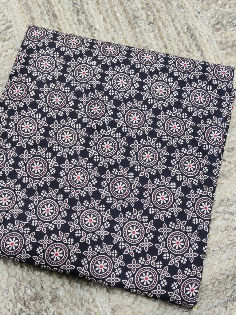 Navy blue fabric with white geometric pattern on a textured surface