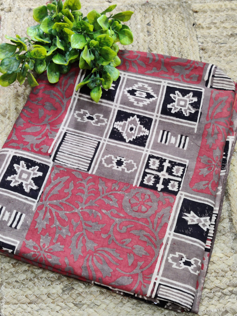 Decorative throw blanket with geometric pattern on a textured surface