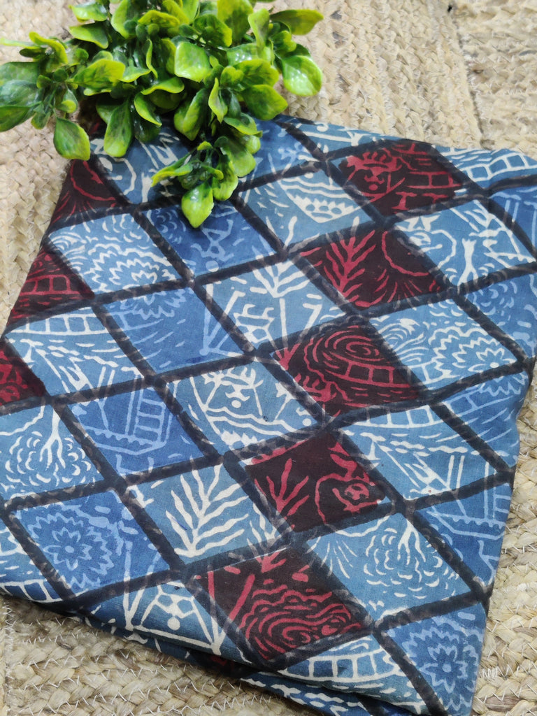 Fabric with a blue and red pattern on a textured surface