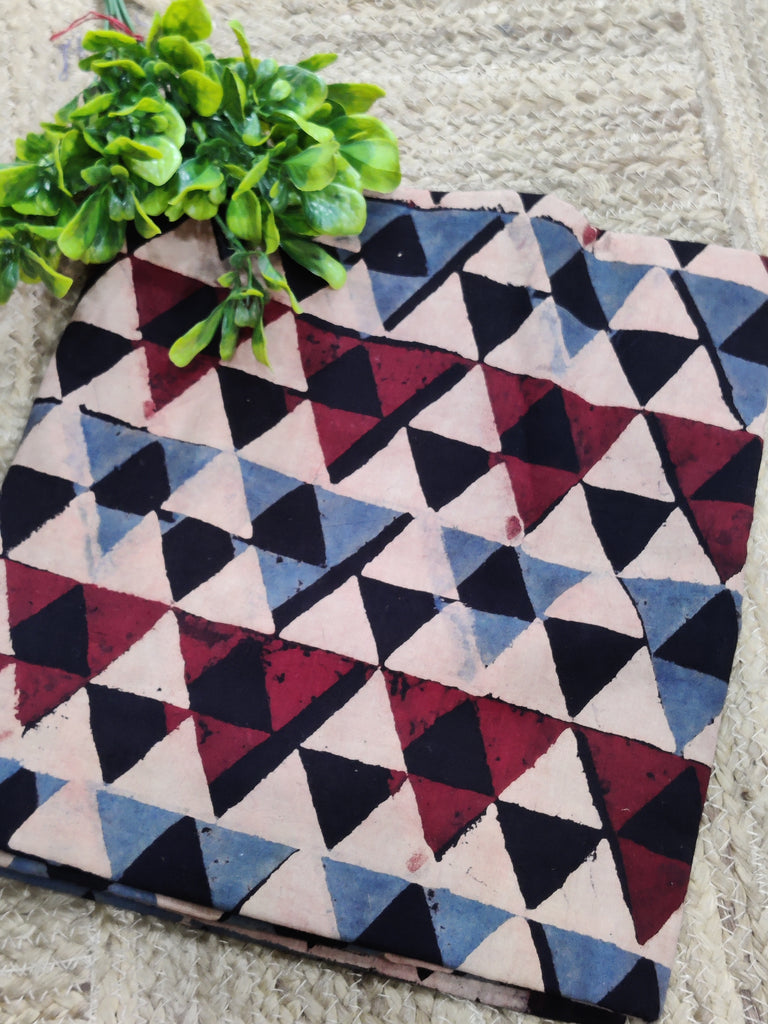 Fabric with geometric triangle pattern on a textured surface