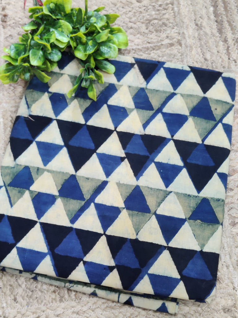 Fabric with blue and white triangle pattern on a textured surface