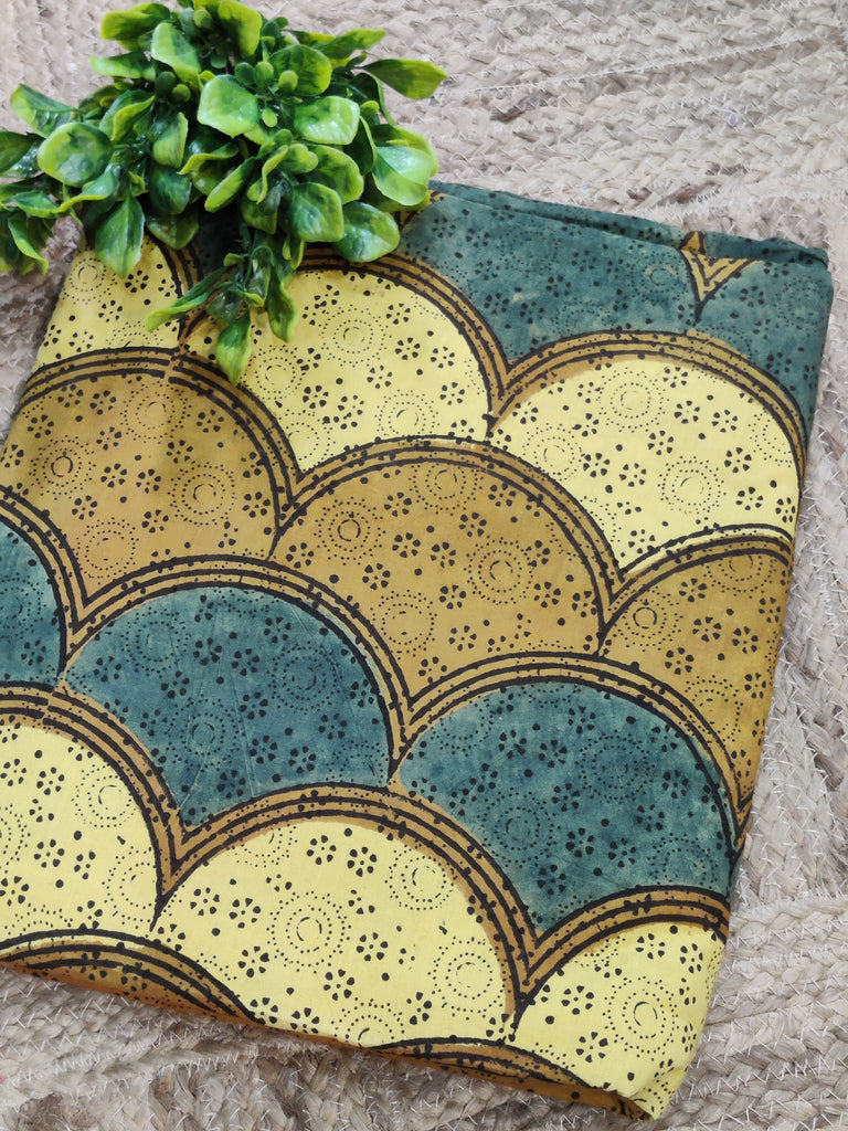 Folded fabric with decorative pattern on a textured surface