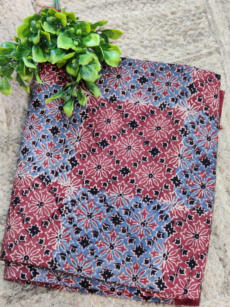 Folded fabric with a floral pattern on a stone surface