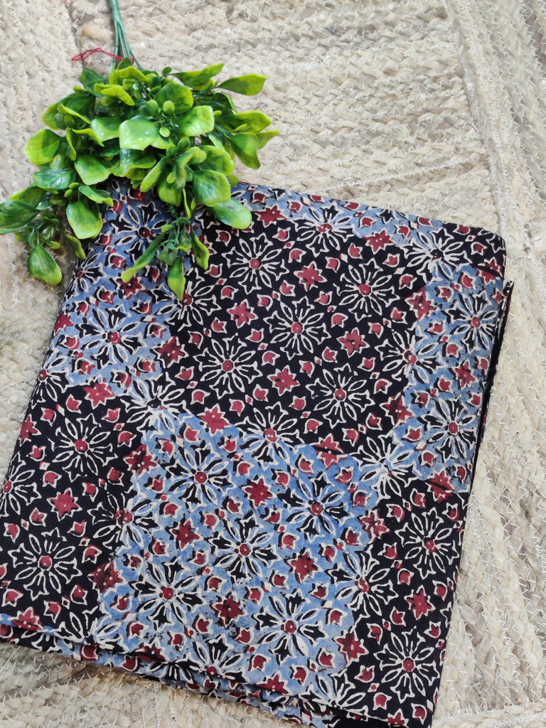 Fabric with a floral pattern on a stone surface