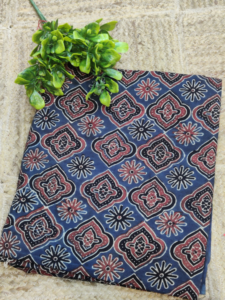 Blue patterned Ajrakh fabric with red and white designs